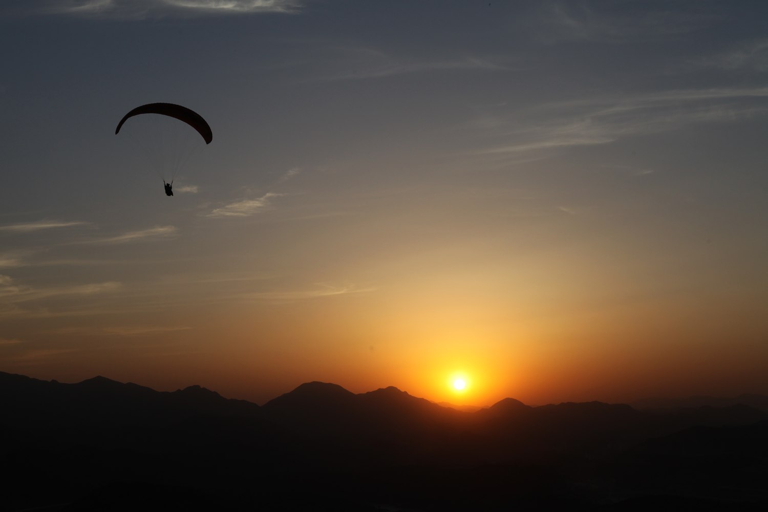 Sun setting behind the ridge